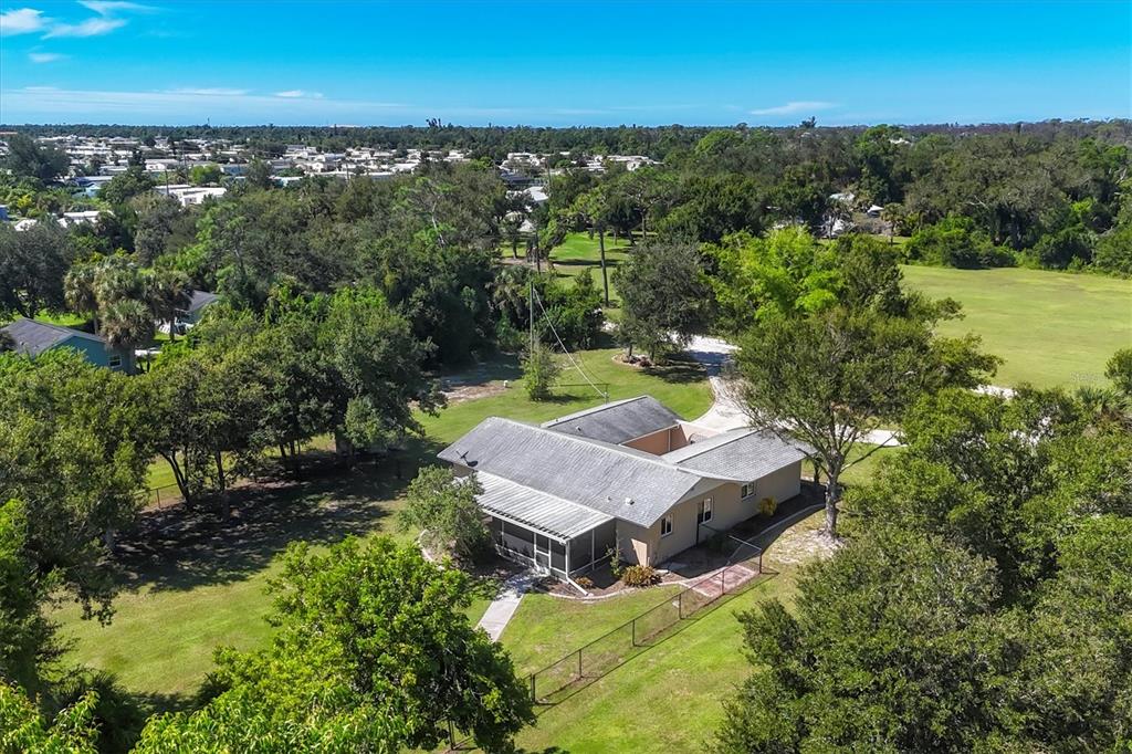 1135 Range Road Englewood, FL 34224 - Photo 40 of 42 an aerial view of a house with yard swimming pool and outdoor seating