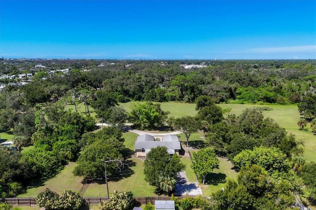 1135 Range Road Englewood, FL 34224 - Photo 41 of 42 an aerial view of a house with a garden
