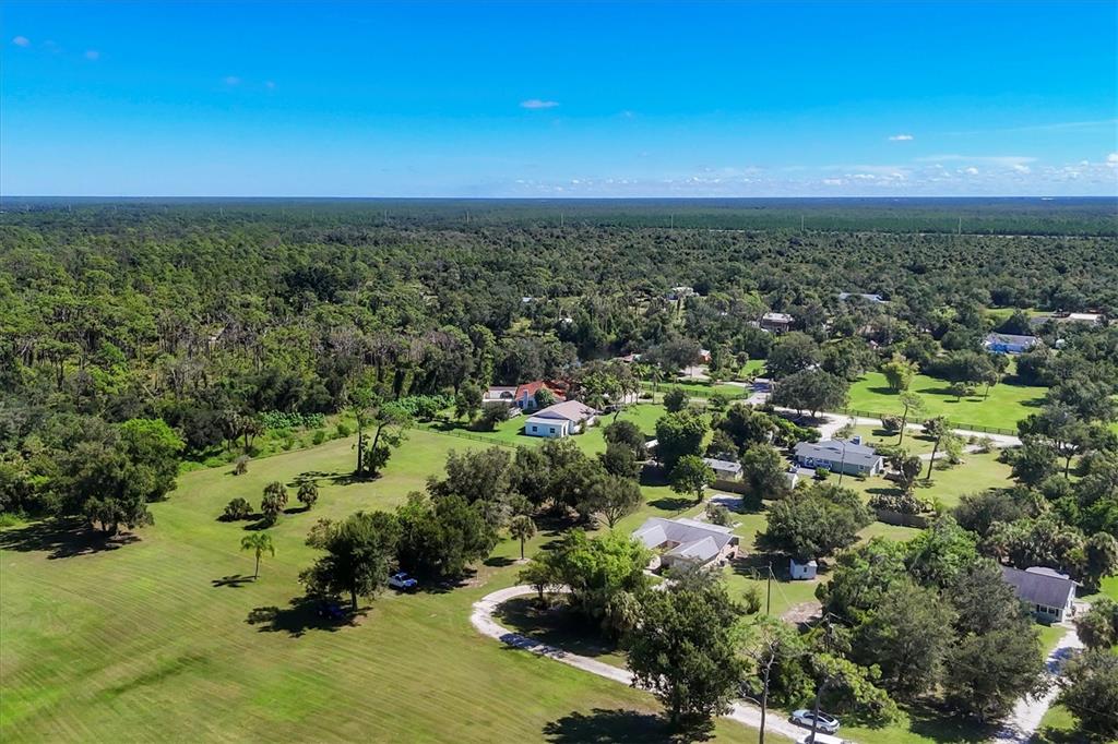 1135 Range Road Englewood, FL 34224 - Photo 7 of 42 an aerial view of residential houses with outdoor space