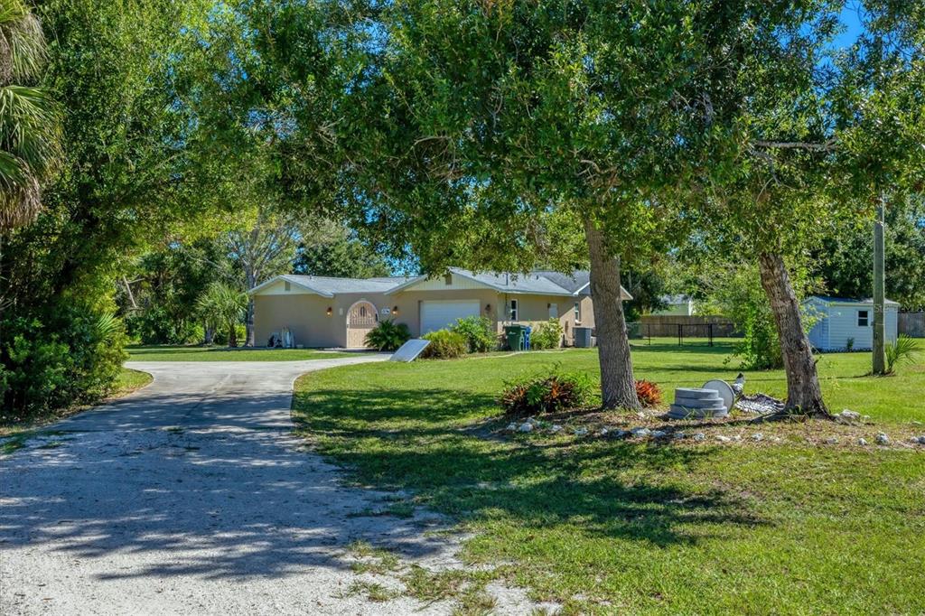 1135 Range Road Englewood, FL 34224 - Photo 8 of 42 a view of a house with a yard