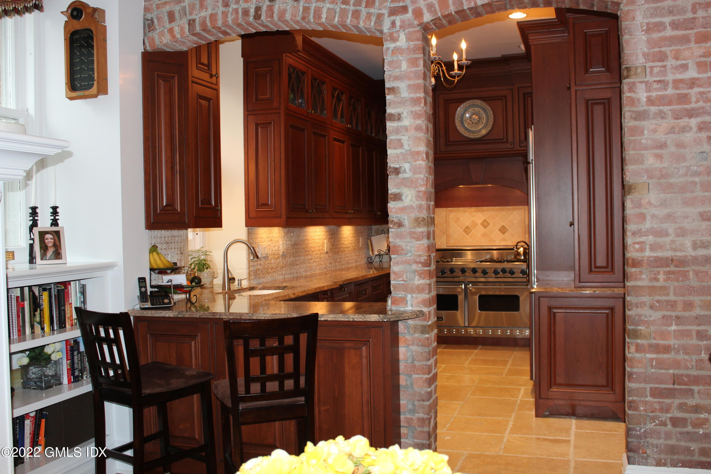 432 Field Point Road Greenwich, CT 06830 - Photo 13 of 56 a kitchen with granite countertop a stove and cabinets