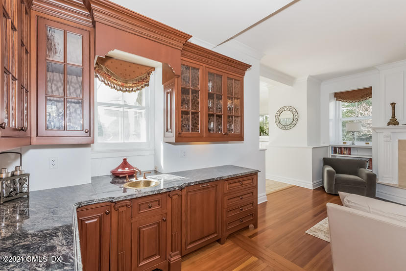 432 Field Point Road Greenwich, CT 06830 - Photo 17 of 56 a kitchen with stainless steel appliances granite countertop a sink and cabinets