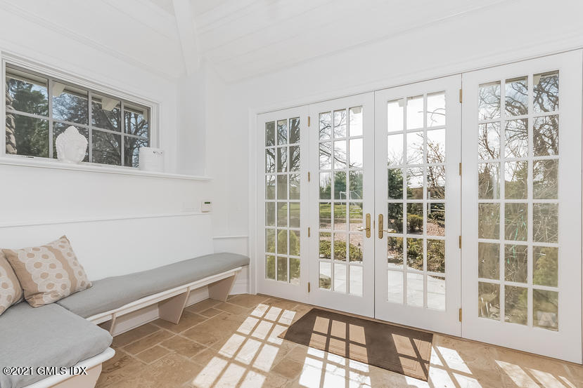 432 Field Point Road Greenwich, CT 06830 - Photo 19 of 56 a living room with furniture and a large window