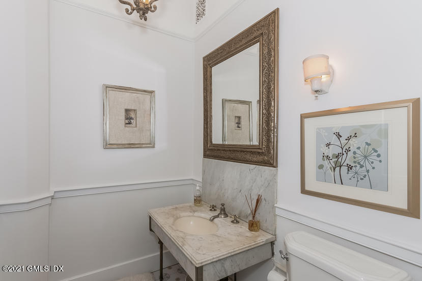 432 Field Point Road Greenwich, CT 06830 - Photo 20 of 56 a view of a hallway with couches and a bathroom