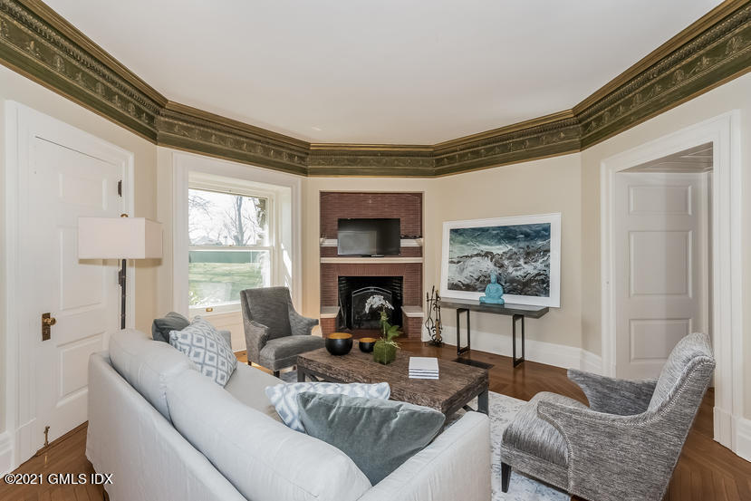 432 Field Point Road Greenwich, CT 06830 - Photo 21 of 56 a living room with furniture and a fireplace
