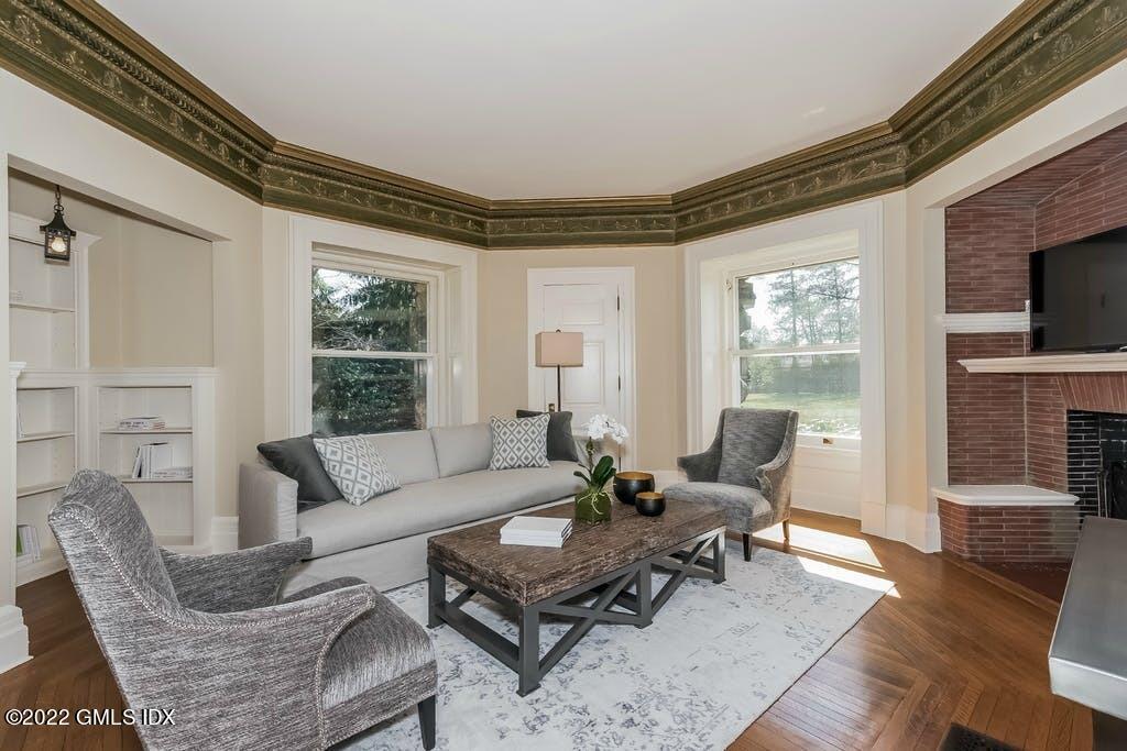 432 Field Point Road Greenwich, CT 06830 - Photo 22 of 56 a living room with furniture and a fireplace
