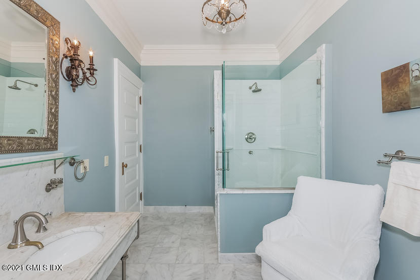 432 Field Point Road Greenwich, CT 06830 - Photo 36 of 56 a bathroom with a sink a toilet and shower