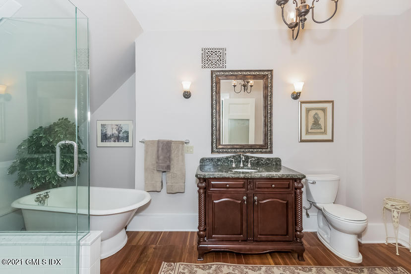 432 Field Point Road Greenwich, CT 06830 - Photo 40 of 56 a living room with stainless steel appliances a dining table and chairs