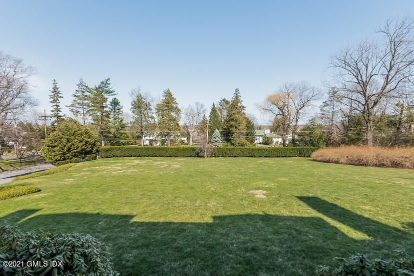 432 Field Point Road Greenwich, CT 06830 - Photo 48 of 56 a view of a field with an trees
