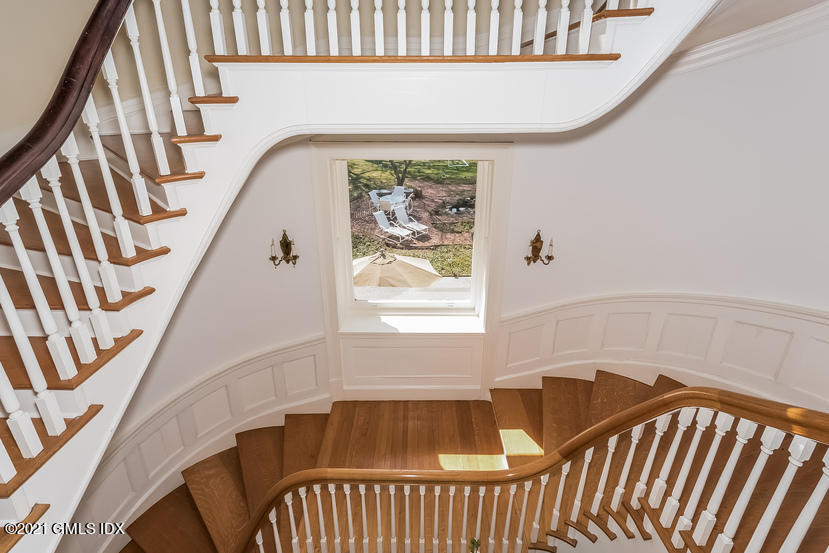 432 Field Point Road Greenwich, CT 06830 - Photo 5 of 56 a view of a bedroom with furniture and a window