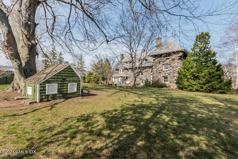 432 Field Point Road Greenwich, CT 06830 - Photo 51 of 56 a view of large house with a yard