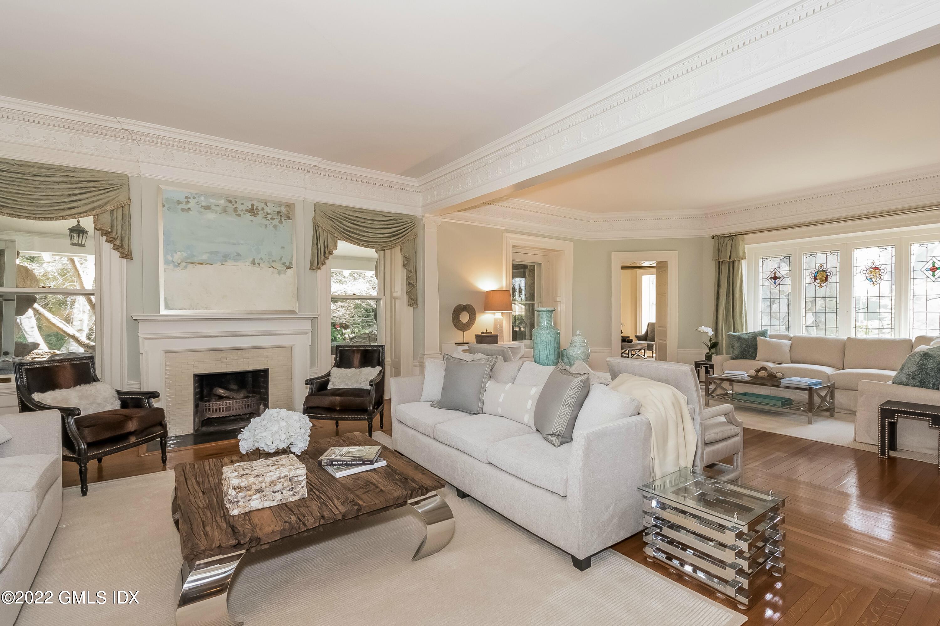 432 Field Point Road Greenwich, CT 06830 - Photo 6 of 56 a living room with furniture fireplace and a large window