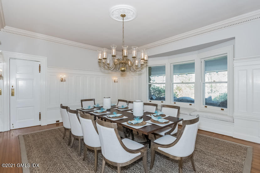 432 Field Point Road Greenwich, CT 06830 - Photo 10 of 56 a dining room with furniture a chandelier and window