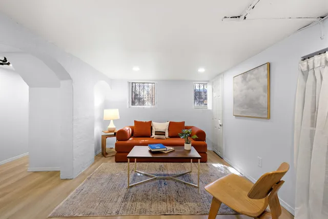 a living room with furniture and a window