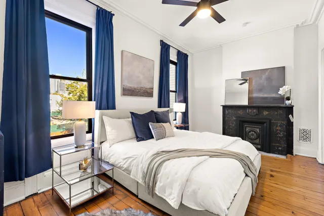 a spacious bedroom with a bed and window