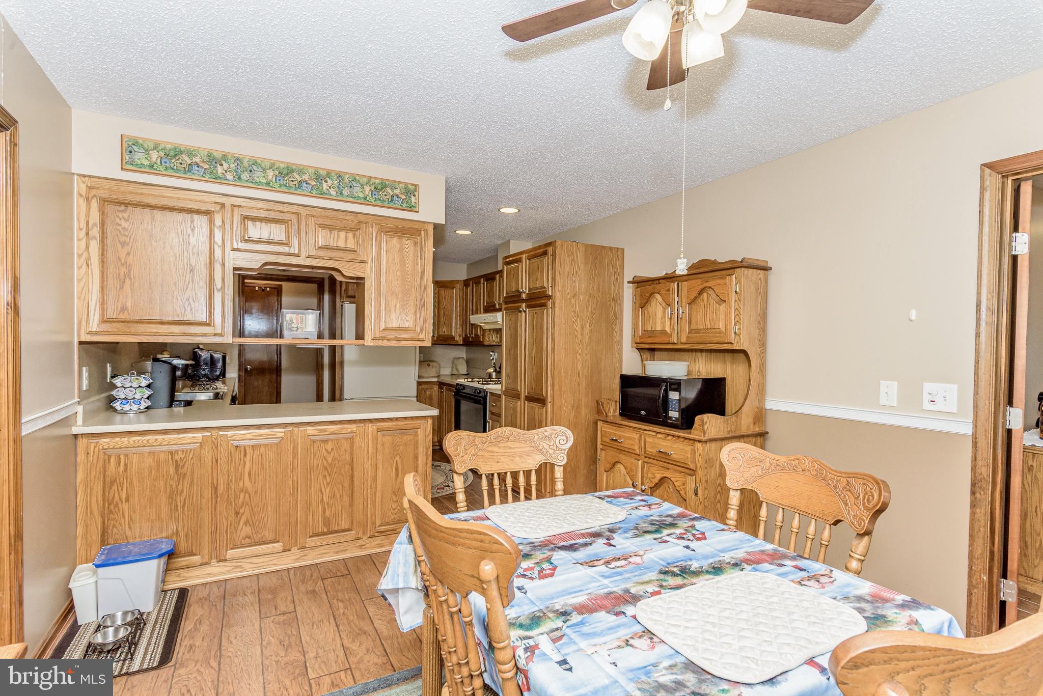 24604 Peterkins Road Georgetown, DE 19947 - Photo 11 of 49 Dining Toward Kitchen