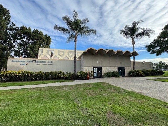 2941 Baltic Avenue Long Beach, CA 90810 - Photo 26 of 30 a front view of a house with garden and patio