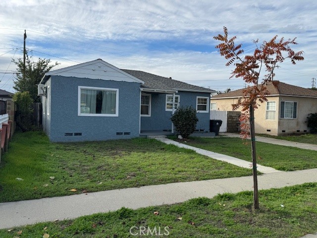 2941 Baltic Avenue Long Beach, CA 90810 - Photo 5 of 30 a front view of a house with garden