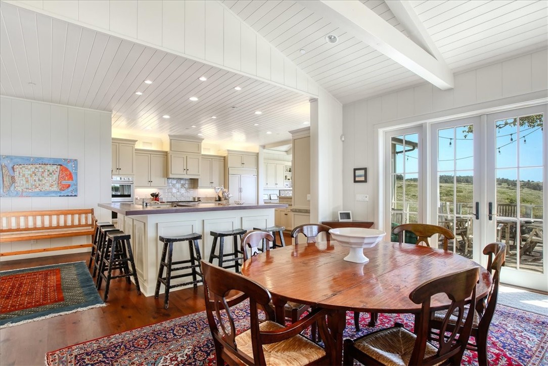 404 Huntington Road Cambria, CA 93428 - Photo 11 of 72 a view of a a dining room with furniture window and wooden floor
