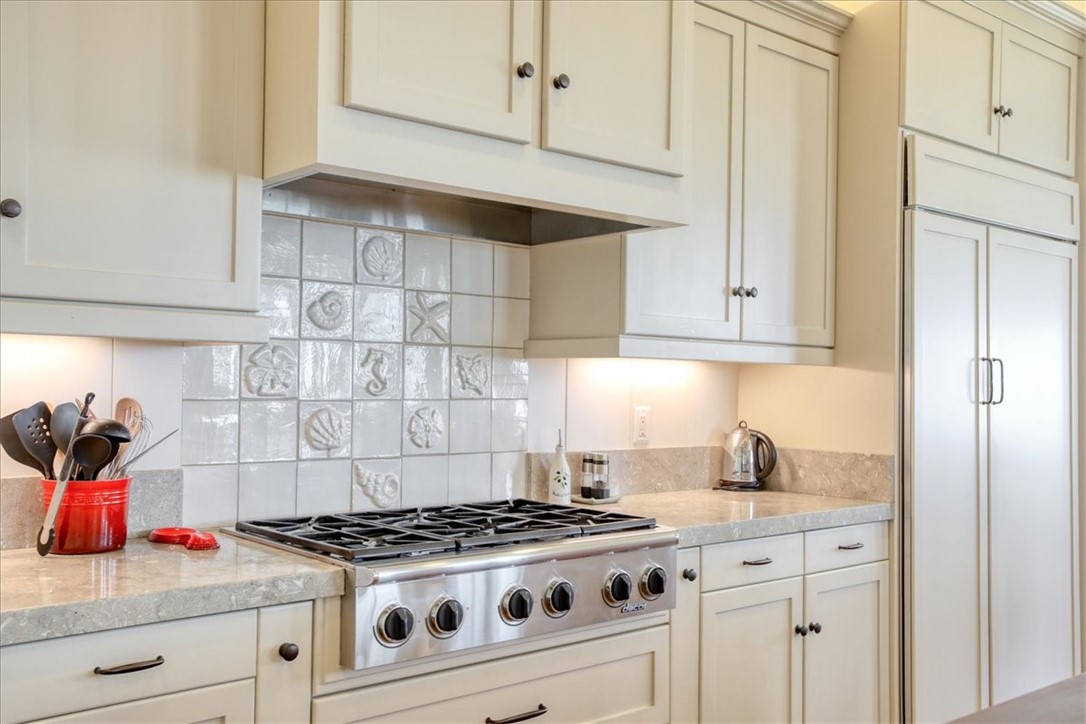 404 Huntington Road Cambria, CA 93428 - Photo 14 of 72 a white stove top oven sitting inside of a kitchen