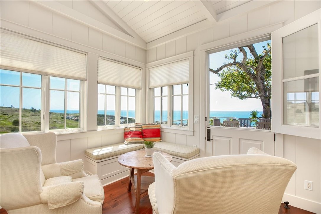 404 Huntington Road Cambria, CA 93428 - Photo 18 of 72 a living room with furniture and a large window