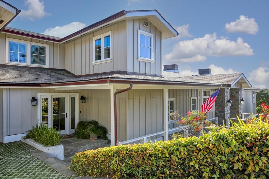 404 Huntington Road Cambria, CA 93428 - Photo 2 of 72 a front view of house along with deck and entertaining space