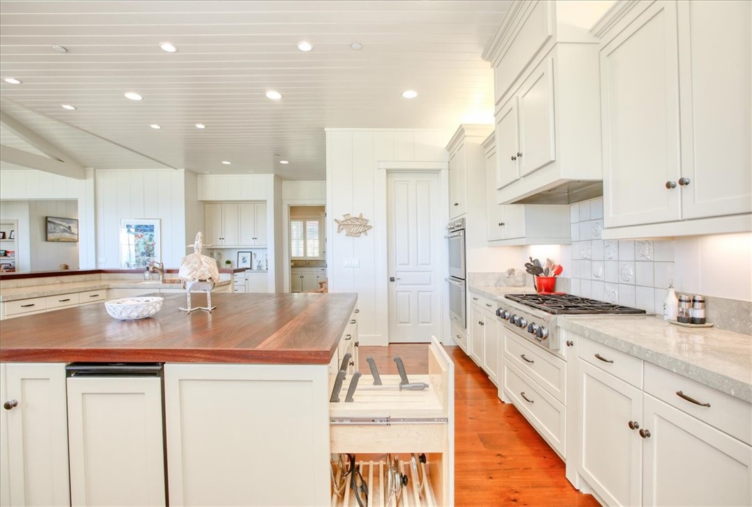 404 Huntington Road Cambria, CA 93428 - Photo 22 of 72 a kitchen with kitchen island granite countertop lots of counter top space