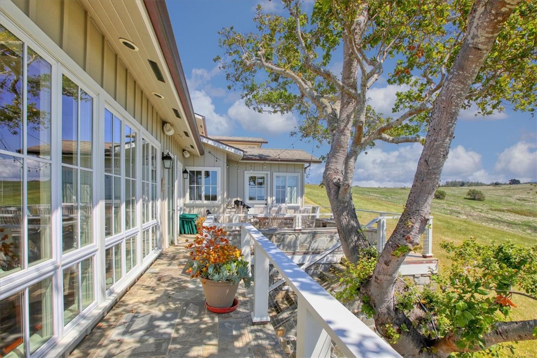 404 Huntington Road Cambria, CA 93428 - Photo 26 of 72 a view of a balcony with chairs and potted plants