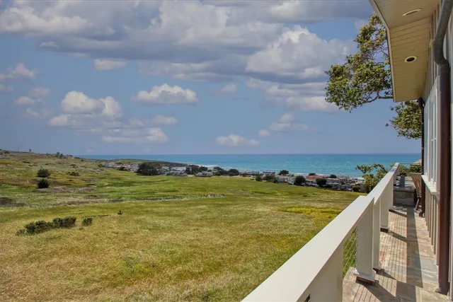 a bathroom with a shower sink and mirror