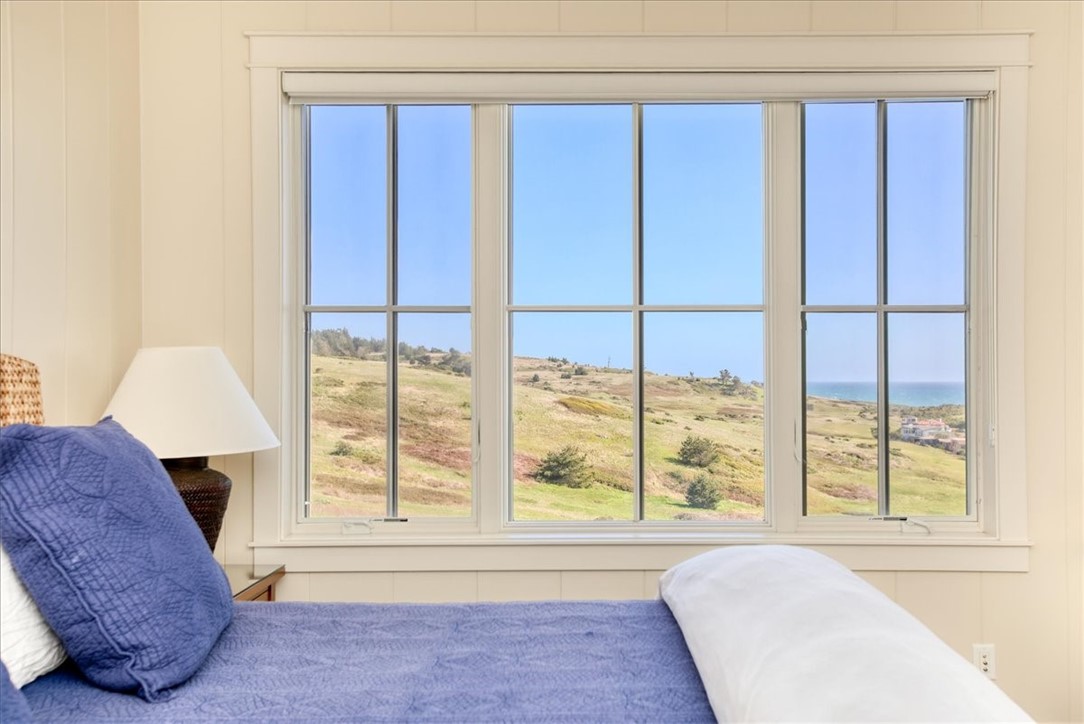 404 Huntington Road Cambria, CA 93428 - Photo 47 of 72 a living room with a large window and a couch