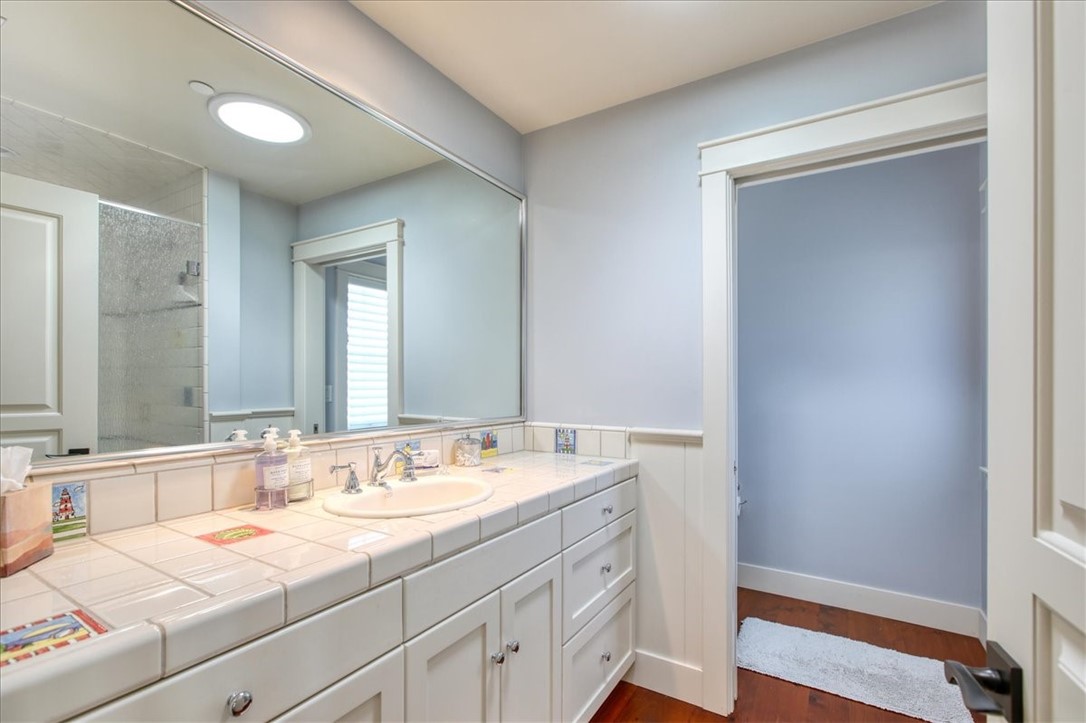 404 Huntington Road Cambria, CA 93428 - Photo 53 of 72 a bathroom with a sink and a mirror