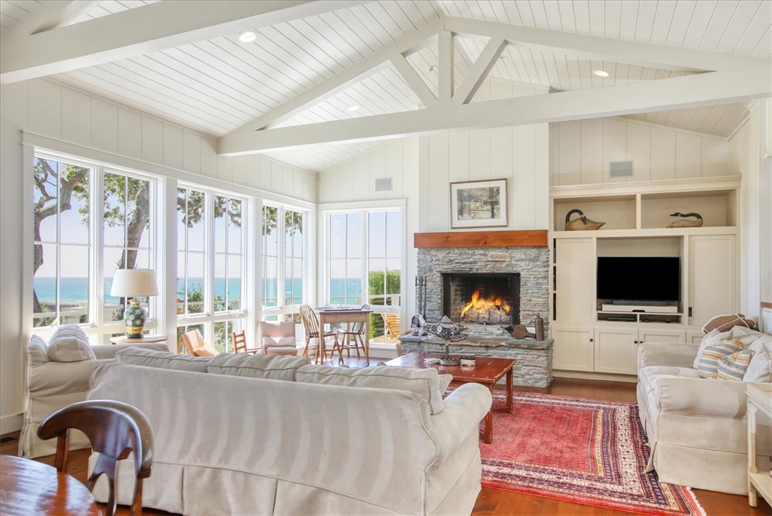 404 Huntington Road Cambria, CA 93428 - Photo 8 of 72 a living room with furniture a fireplace and a flat screen tv