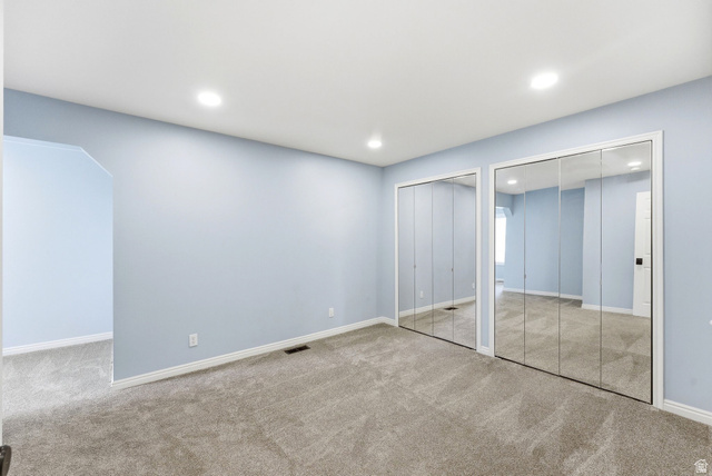 1041 West Grindelwald Court, Unit R5 Midway, UT 84049 - Photo 22 of 44 Bedroom in Midway condo for sale with mirrored closet doors, carpet flooring, and attached flex space
