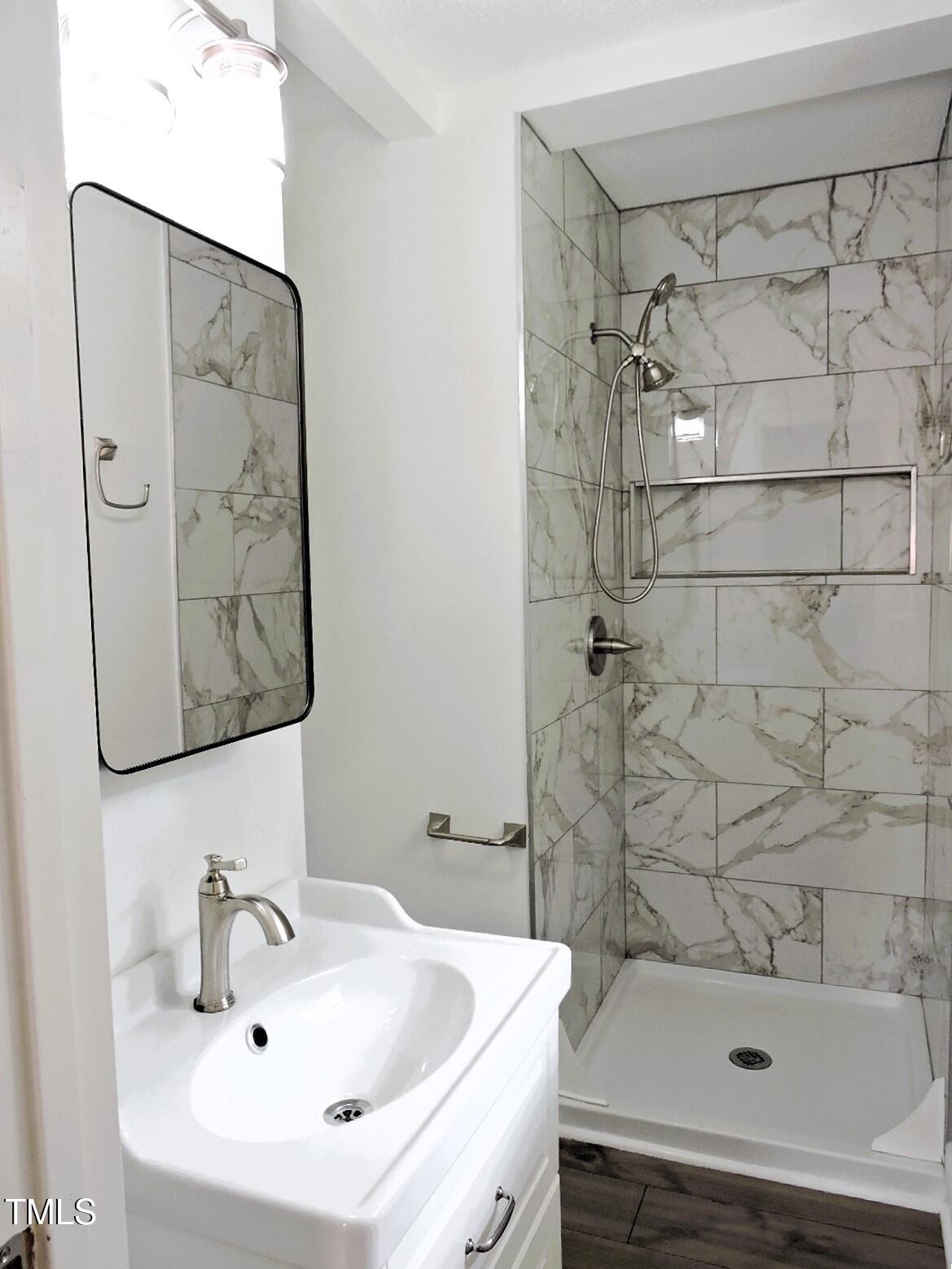 1620 Riddle Road Durham, NC 27713 - Photo 16 of 28 a bathroom with a sink and a tub