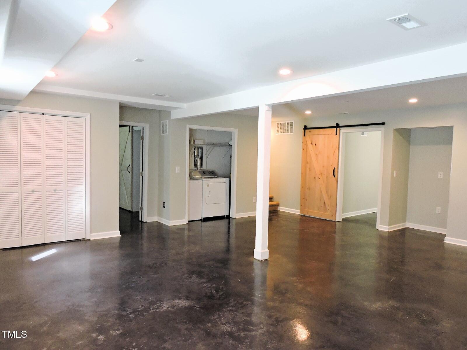 1620 Riddle Road Durham, NC 27713 - Photo 22 of 28 an empty room with wooden floor and windows