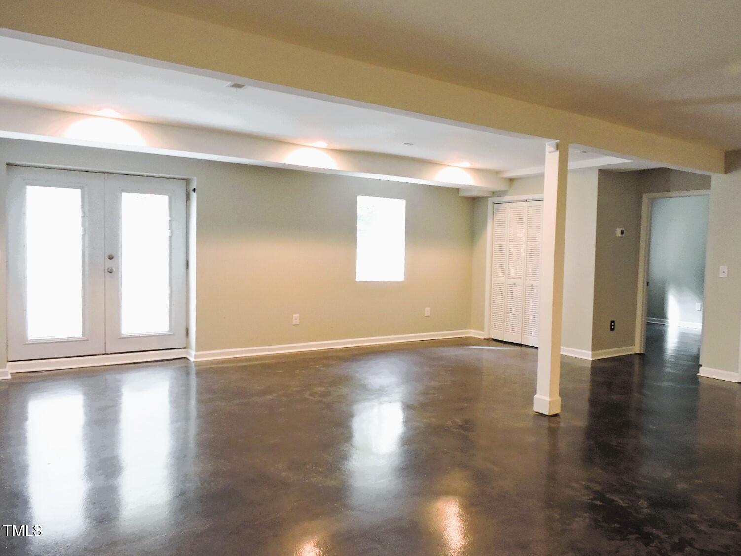 1620 Riddle Road Durham, NC 27713 - Photo 23 of 28 an empty room with wooden floor and windows