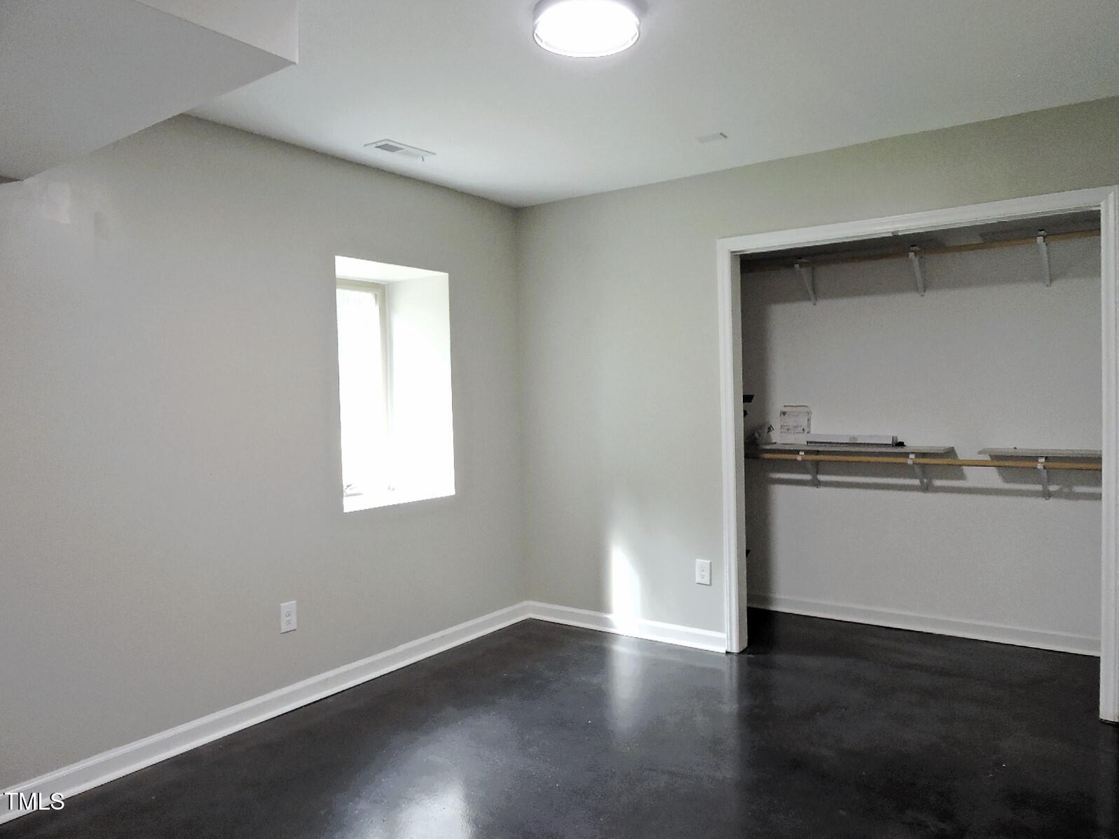 1620 Riddle Road Durham, NC 27713 - Photo 24 of 28 wooden floor in an empty room with a window