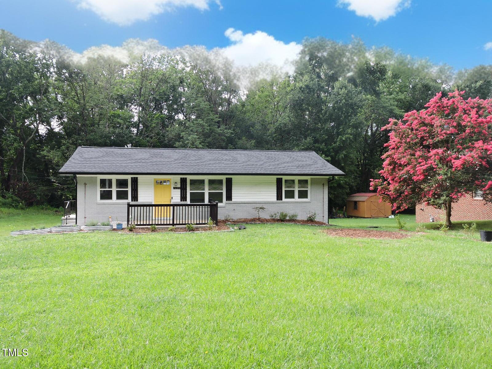 1620 Riddle Road Durham, NC 27713 - Photo 3 of 28 front view of a house with a big yard