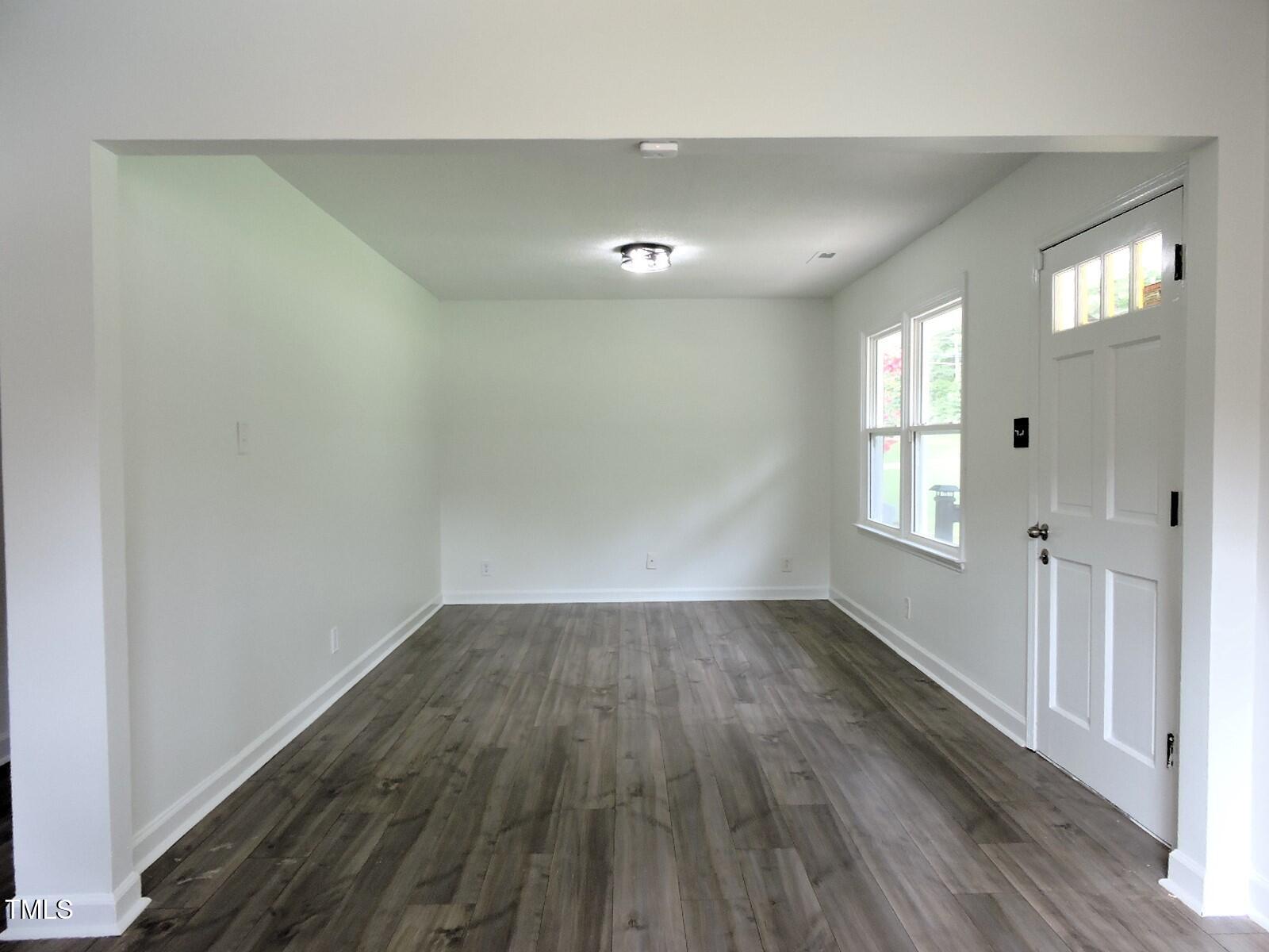 1620 Riddle Road Durham, NC 27713 - Photo 8 of 28 wooden floor in an empty room with a window