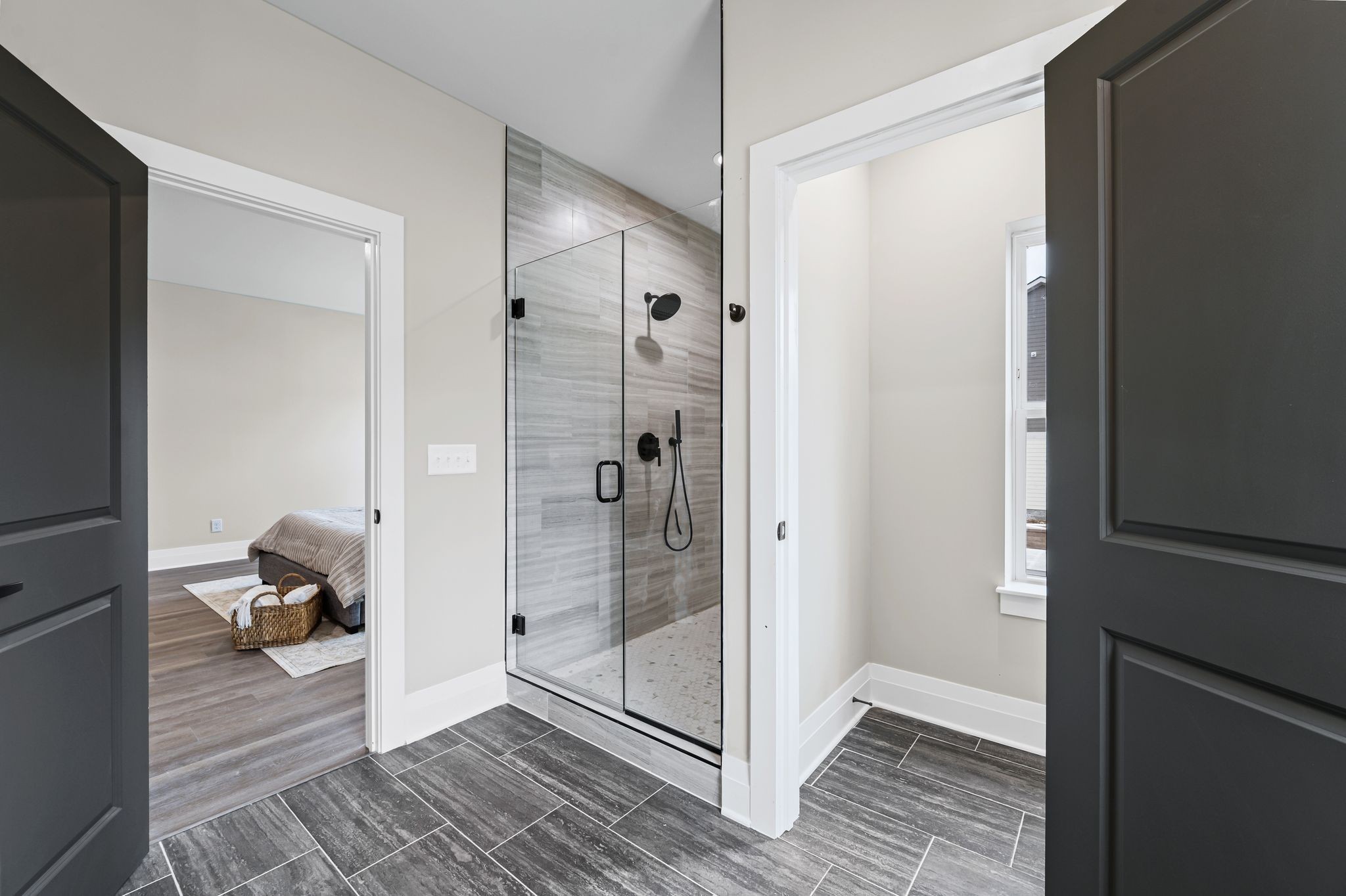 1036 Noble Loop, Unit 34 Nashville, TN 37211 - Photo 17 of 34 a bathroom with a glass door shower and a mirror