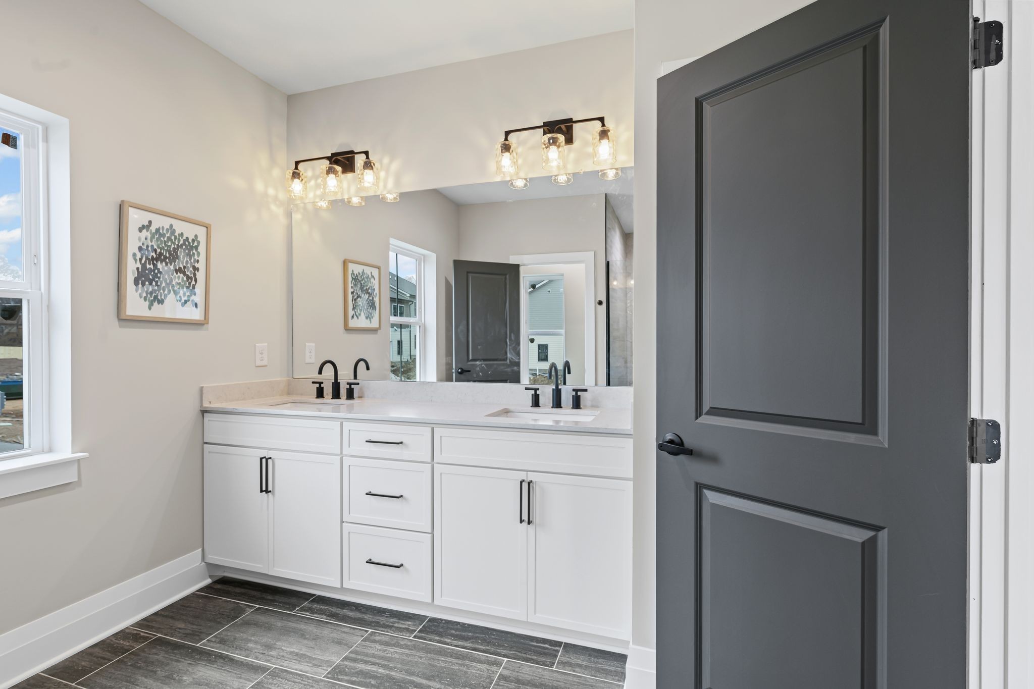 1036 Noble Loop, Unit 34 Nashville, TN 37211 - Photo 19 of 34 a spacious bathroom with a double vanity sink and a mirror
