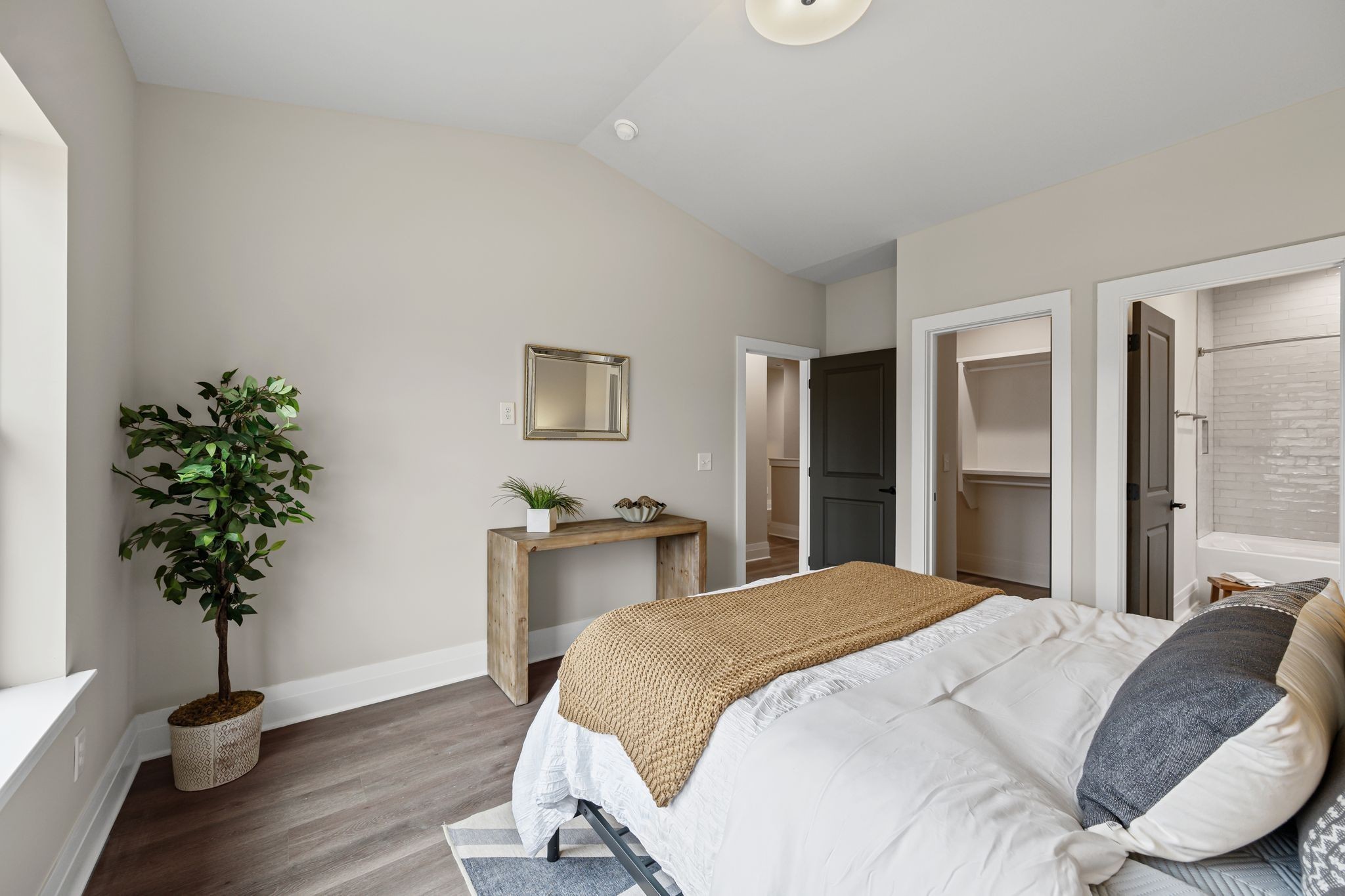1036 Noble Loop, Unit 34 Nashville, TN 37211 - Photo 21 of 34 a bedroom with a bed and a potted plant
