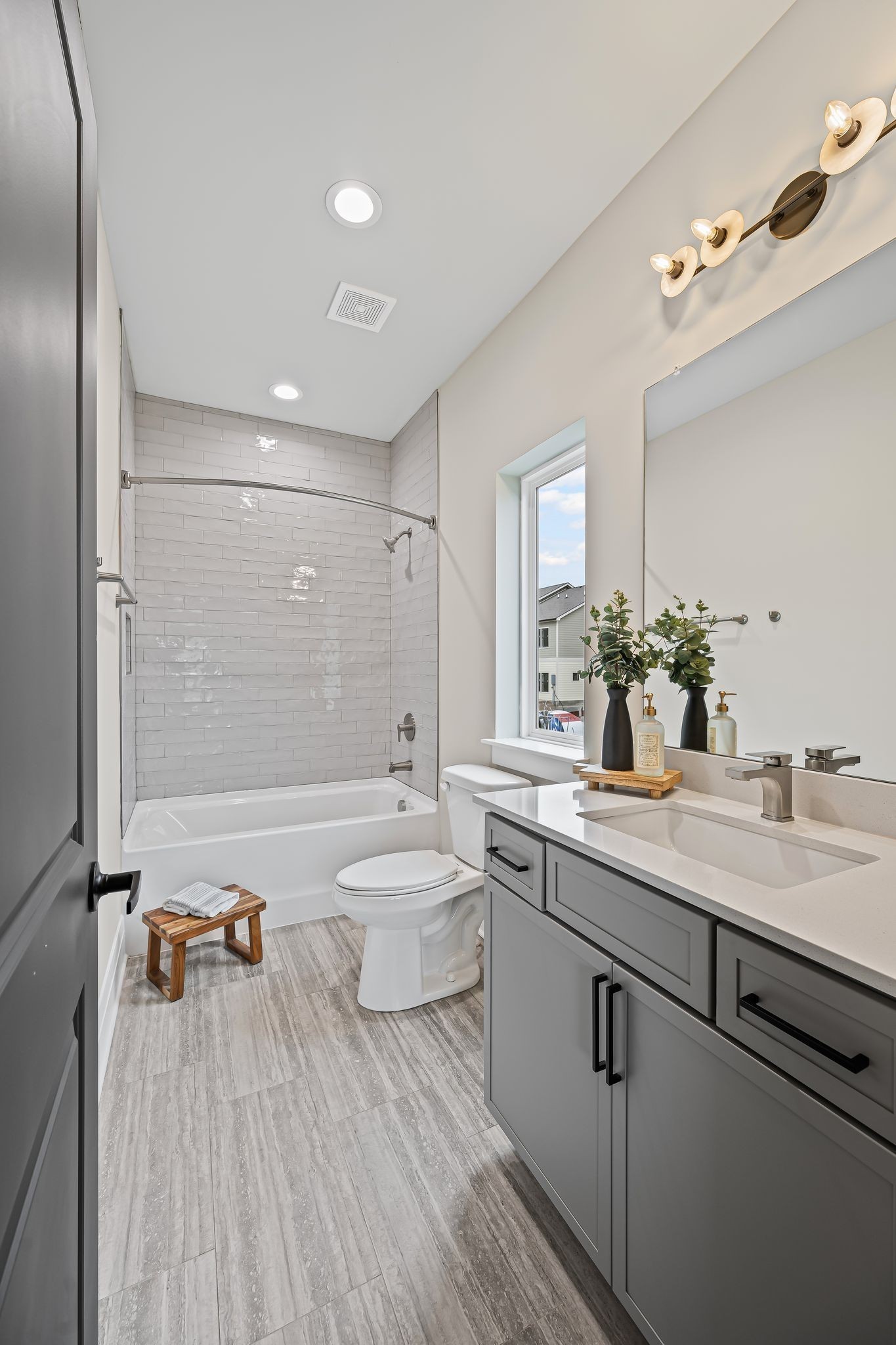 1036 Noble Loop, Unit 34 Nashville, TN 37211 - Photo 22 of 34 a spacious bathroom with a double vanity sink a mirror and a bathtub