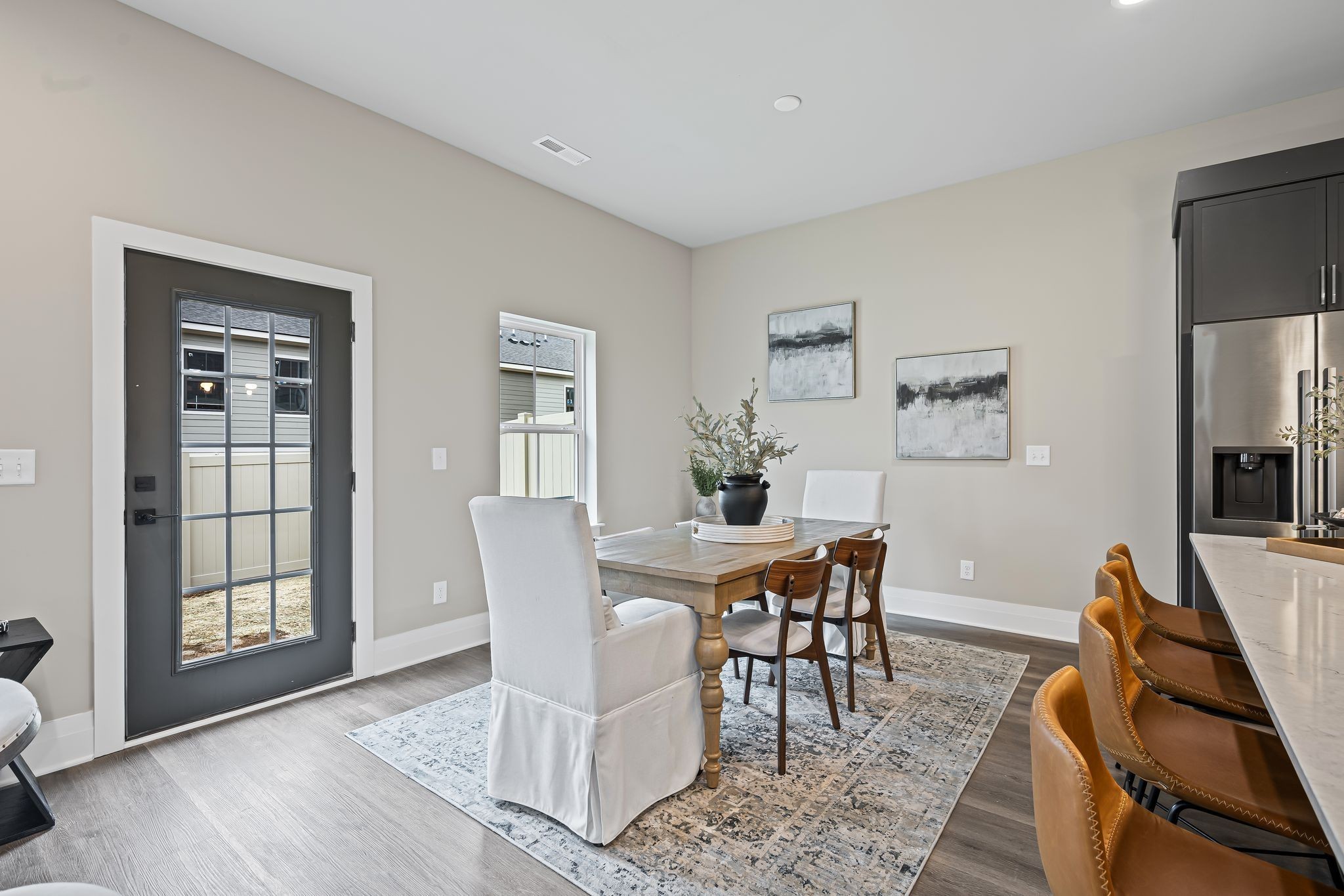 1036 Noble Loop, Unit 34 Nashville, TN 37211 - Photo 9 of 34 a view of a dining room with furniture and wooden floor