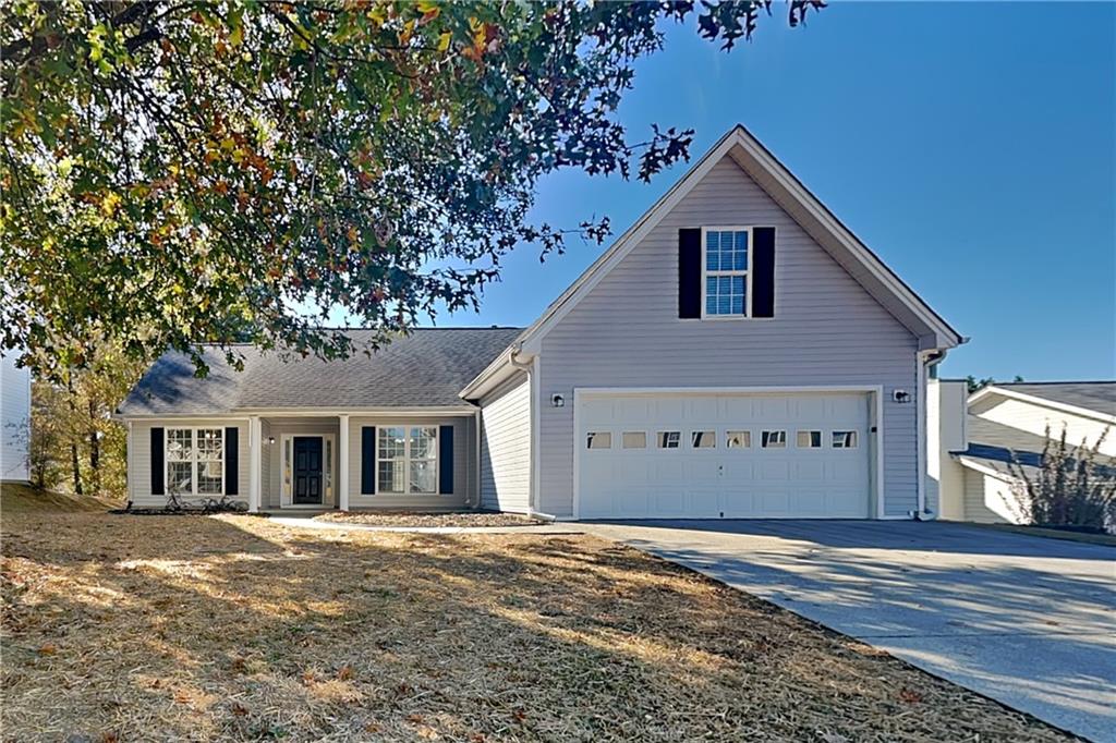 257 Ashland Park Court Southeast Lawrenceville, GA 30045 - Photo 1 of 21 front view of a house with a big yard