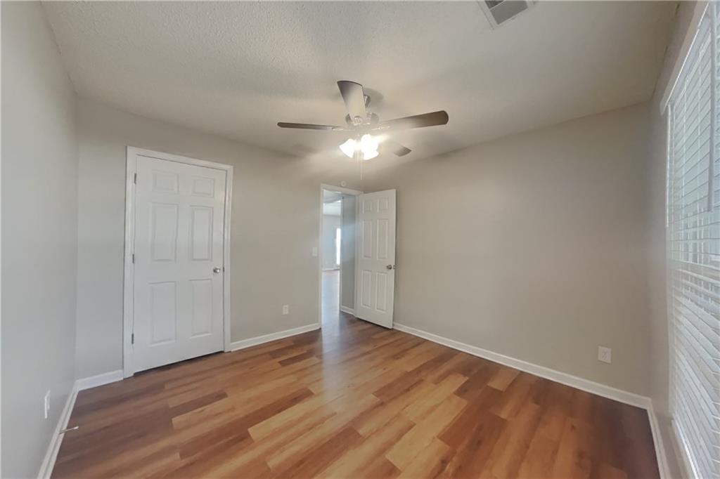 257 Ashland Park Court Southeast Lawrenceville, GA 30045 - Photo 13 of 21 wooden floor in an empty room
