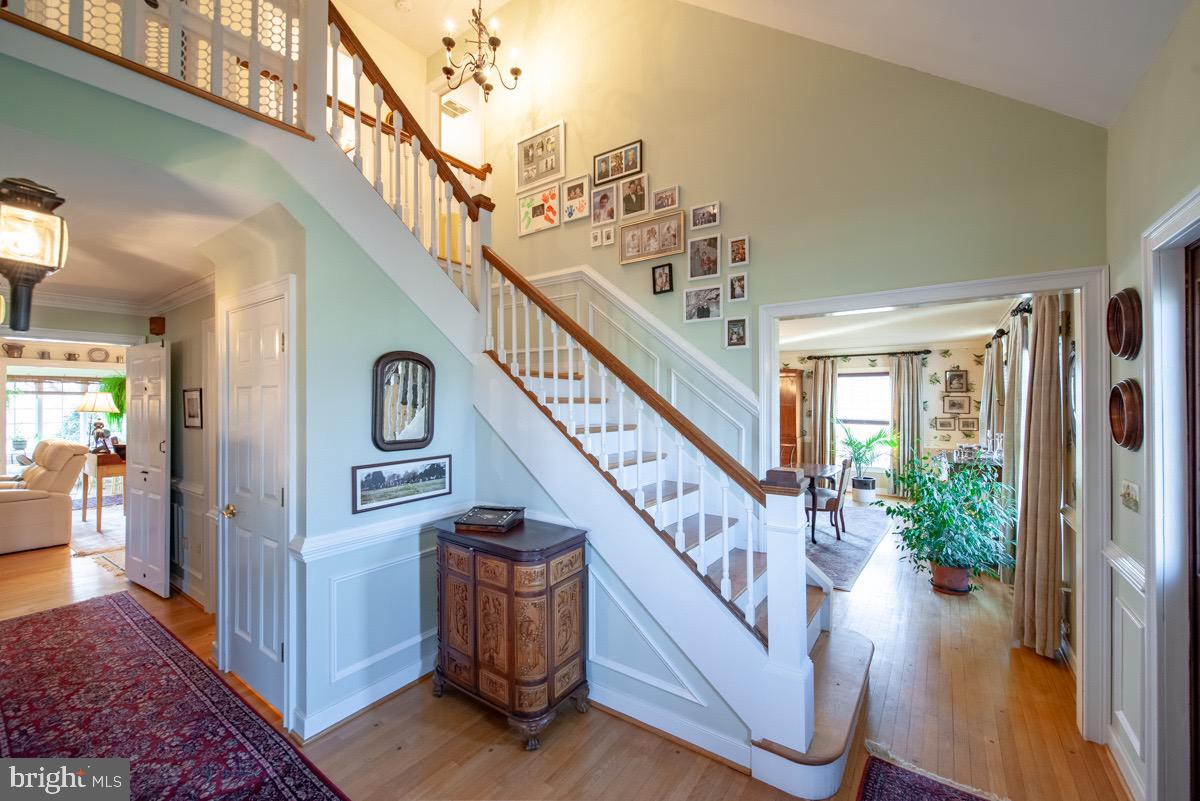 6089 Fishers Station Road Lothian, MD 20711 - Photo 18 of 75 Foyer and stairs to 2nd floor