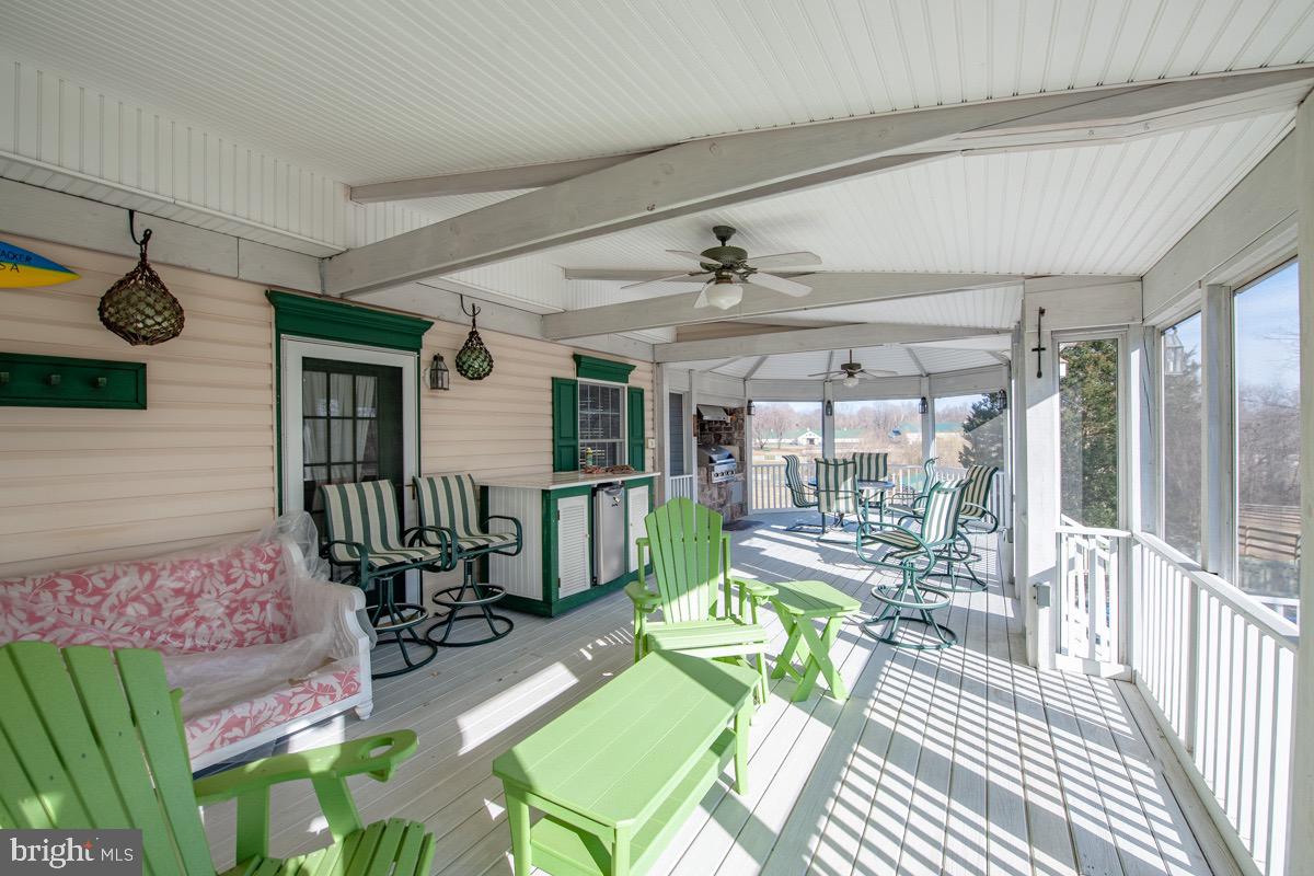 6089 Fishers Station Road Lothian, MD 20711 - Photo 27 of 75 Screened porch overlooks pasture and pool