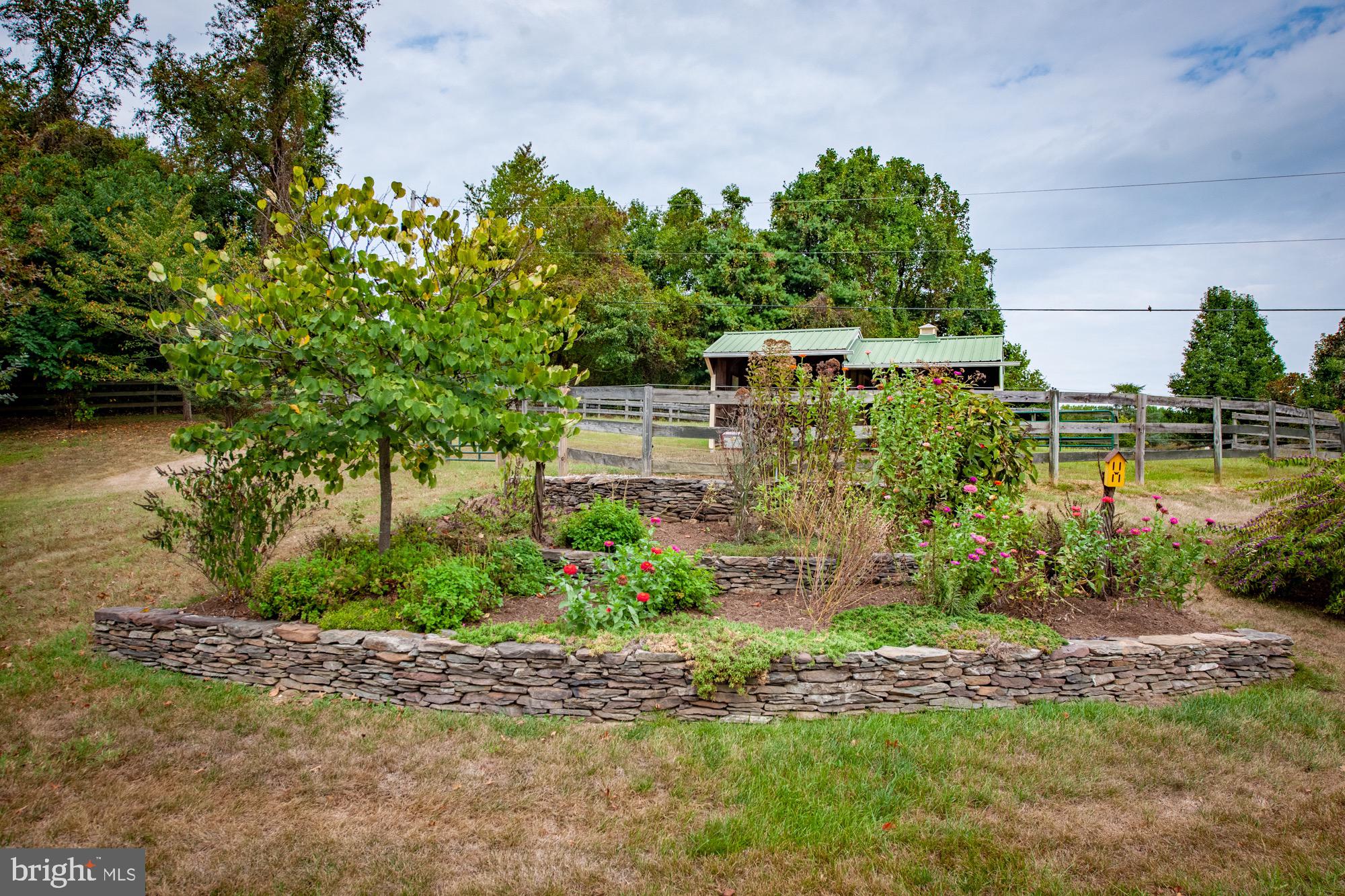 6089 Fishers Station Road Lothian, MD 20711 - Photo 42 of 75 Mature landscaping and gardens