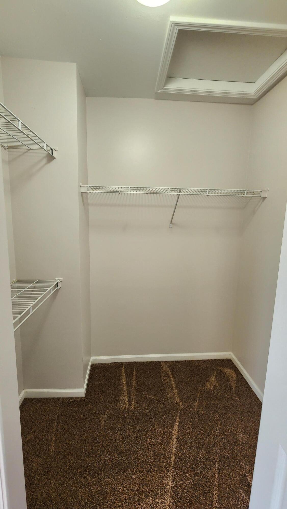 1574 Kessler Avenue Keego Harbor, MI 48320 - Photo 16 of 28 walk in closet-primary bedroom